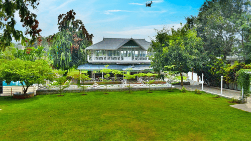Spacious green lawn with a beautiful building in the background